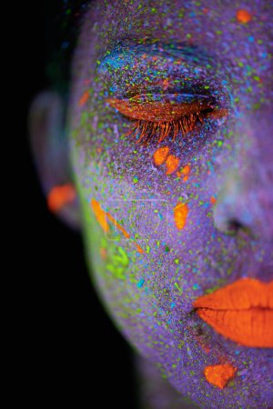 Photo for Face, neon and makeup closeup for creative, art and glitter with unique surreal glow. Person, science fiction and color with dream, rave and abstract uv illusion for mystical fluorescent trance. - Royalty Free Image