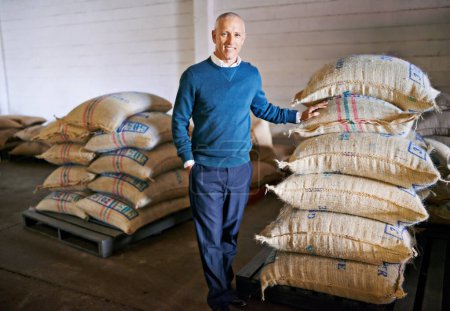 Coffee, factory and portrait of man with bag for distribution, quality control and confident logistics. Export, manufacturing and proud entrepreneur with beans at warehouse for sustainable business.