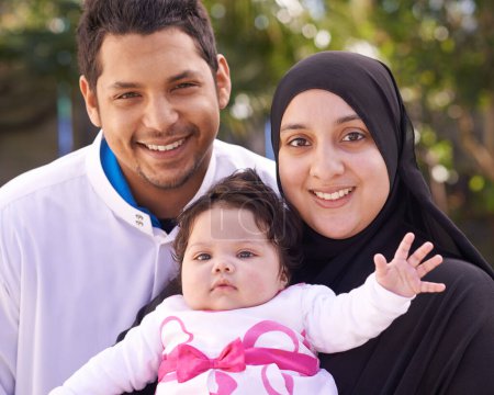 Photo for Muslim family, park and portrait of parents with baby for bonding, smile and outdoors together. Islam, happy and mother, father and newborn infant for love, childcare or support in garden. - Royalty Free Image