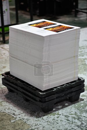 Printing, warehouse and paper stack for manufacturing or distribution, ready for packaging and production. Factory, designed parchment or documents for newspaper or magazines, worksheets and posters