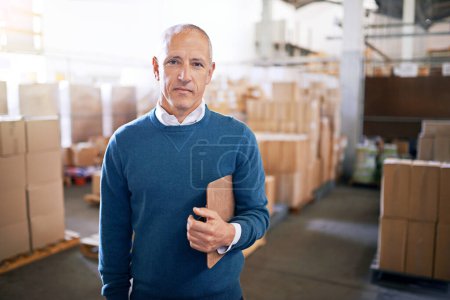 Photo for Boxes, confidence and portrait of businessman in warehouse with package, logistics and distribution. Export, commerce and manager at cargo storage factory with clipboard, pride and supply chain job. - Royalty Free Image