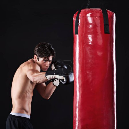 Photo for Man, punching bag and martial arts with fitness, challenge and fighter with gloves and wellness with workout. Boxer, practice and athlete with exercise and training with endurance, health or progress. - Royalty Free Image