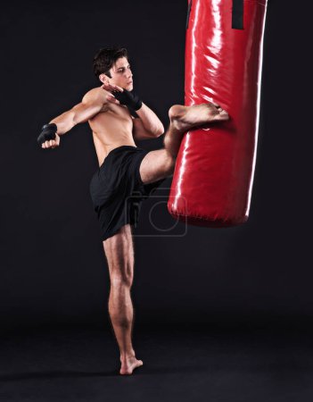 Photo for Kickboxing, challenge and man with training, fitness and exercise on a dark studio background. Healthy person, mockup space and model with endurance and progress with workout and wellness with cardio. - Royalty Free Image