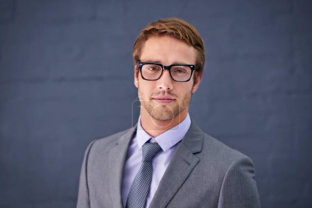Photo for Caucasian, man and business with glasses in studio for paralegal work, clerk or assistant or counsel. Businessman and spectacles on backdrop for legal profession, associate attorney or barrister. - Royalty Free Image