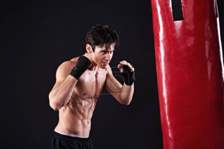 Photo for Man, punching bag and martial arts with exercise, training and fighter with gloves and wellness with power. Boxer, practice and athlete with fitness and workout with endurance, healthy and progress. - Royalty Free Image