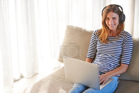 Headphones, face and woman with laptop for online education, e learning and homeschooling in living room. Female person, scholar and university student at home for remote class, studying and tuition.