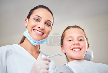 Photo for Woman, portrait and dentist for oral care or kid, suction and tool for treatment or hygiene. Female person, confidence and orthodontist for cleaning teeth, specialist and patient for gum health. - Royalty Free Image
