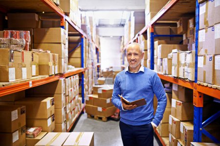 Photo for Tablet, portrait or mature man with factory logistics for a delivery order in workshop on internet by boxes. Online, smile or supply chain for ecommerce product, package or wholesale cargo shipping. - Royalty Free Image