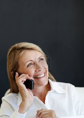 Photo for Woman, business and phone call with communication, employee and consultant on a dark background. Mature person, entrepreneur and financial adviser with cellphone and mobile user with network and app. - Royalty Free Image