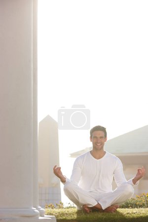 Photo for Portrait, happy or yogi in mindfulness, meditation or zen practice as spiritual, health or temple. Man, smile or pose on grass as balance, holistic or gratitude in hope, wellness or joy on mockup. - Royalty Free Image
