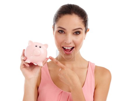 Photo for Portrait, woman and pointing at piggy bank in studio for budget, finance or investment. Face, excited or person with money box for savings, income or security of profit isolated on a white background. - Royalty Free Image