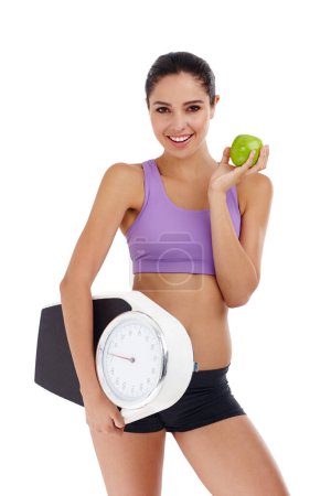 Photo for Portrait, scale and woman with wellness, apple and healthy person isolated on a white studio background. Face, happy girl and model with smile and exercise with diet plan and weight loss with fruit. - Royalty Free Image