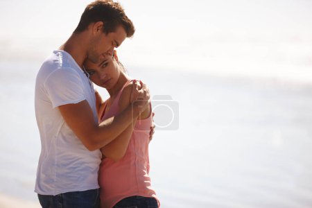 Photo for Couple, hug and comfort at beach with empathy, sad woman and man with love, care and time together outdoor. Safety, security and trust for comfort or support with compassion in relationship. - Royalty Free Image