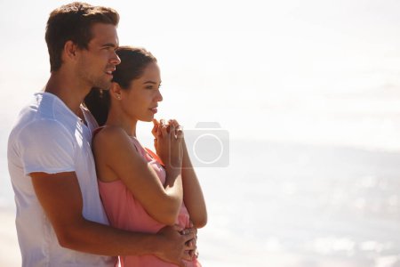 Photo for Happy couple, embrace and ocean view for relax holiday or weekend date, beach or vacation. Man, woman and with hug for relationship getaway or calm summer for bonding connection, wellness or travel. - Royalty Free Image