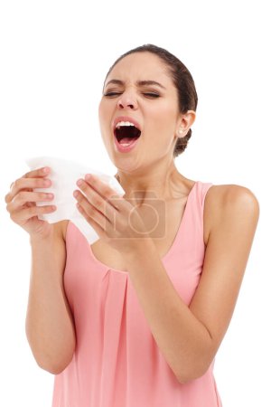 Photo for Sick, sneeze and woman on a white background with allergies, sore throat and chest infection. Sickness, healthcare and isolated person with tissue for illness, pain and asthma symptoms in studio. - Royalty Free Image