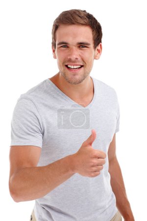 Photo for Thumbs up, happy and portrait of man on a white background with hand sign, emoji and gesture. Confidence, smile and face of isolated person with signal for agreement, thank you and promote in studio. - Royalty Free Image