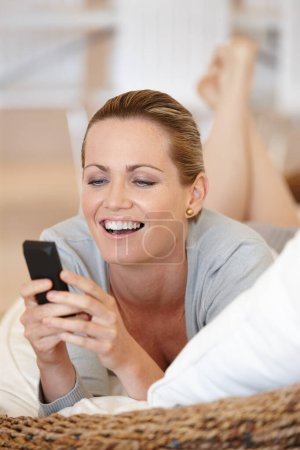 Photo for Relax, phone or happy woman on sofa for social media, streaming movie or film on internet or web. Smile, chat or female person in home texting on online on mobile app to search fora funny meme post. - Royalty Free Image