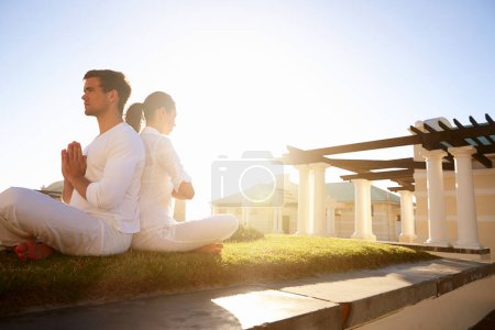 Photo for Grass, prayer pose and couple at yoga retreat with balance, peace and relax in mindfulness at outdoor resort. Zen, man and woman in calm meditation for holistic health, spiritual wellness and namaste. - Royalty Free Image