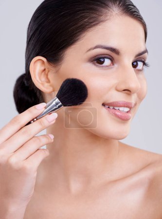 Photo for Woman, portrait and makeup brush in studio for beauty blush, cosmetics or grey background. Female person, facial contour and treatment transformation for makeover wellness, mockup space or routine. - Royalty Free Image