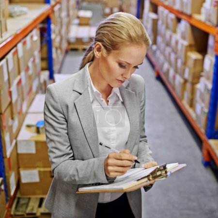 Photo for Woman, clipboard and paperwork in logistics warehouse for importing goods. Professional female person, employee and distribution in commercial freight company of lead suppliers and deliveries - Royalty Free Image