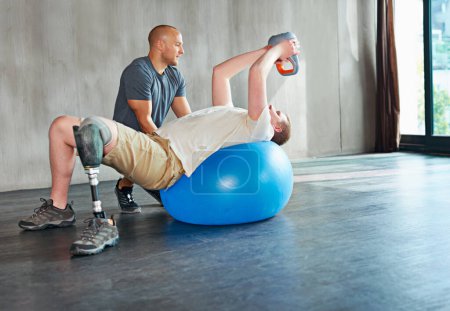 Photo for Physiotherapy, disability and patient with kettlebell or exercise ball at gym for recovery, strength and healthcare rehabilitation. Physiotherapist, wellness and support or consultation for amputee. - Royalty Free Image