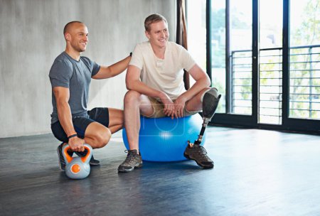 Photo for Personal trainer, man with disability or leg in fitness, exercise or strength training for health. Male physio, kettlebell or prosthesis to relax in support, motivation or professional physiotherapy. - Royalty Free Image