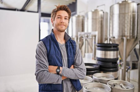 Photo for Brewery, man and portrait with arms crossed in factory with confidence, pride and container machine for manufacturing. Industrial, worker and smile in distillery with tank for brewing in warehouse. - Royalty Free Image