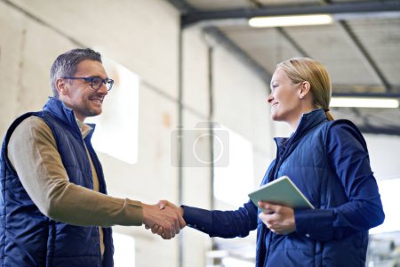 Photo for Welcome, deal and business people with handshake for partnership, distribution or agreement. Professional, technology and shaking hands for export support, b2b networking or onboarding in warehouse. - Royalty Free Image
