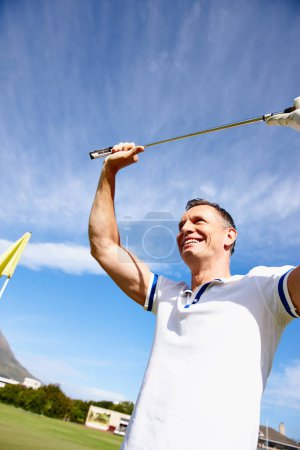 Photo for Happy man, golfer and celebration with club for winning, sports or goal on outdoor field or green grass. Excited male person or golf player with smile or enjoying fun game, victory or point in nature. - Royalty Free Image