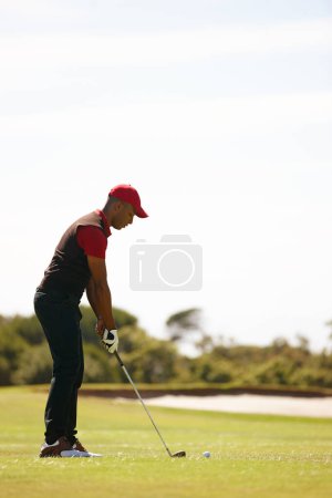 Photo for Man, playing and golf course with club or ball for stroke, point or strike on grass field in nature. Male person, golfer or sport player getting ready for swing, game or outdoor match on mockup space. - Royalty Free Image