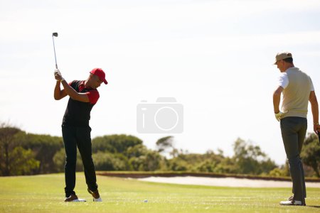 Photo for Man, friends and swing with club on golf course for stroke, point or strike on grass field in nature. Male person, sports player or golfer hitting ball for friendly game, match or outdoor competition. - Royalty Free Image
