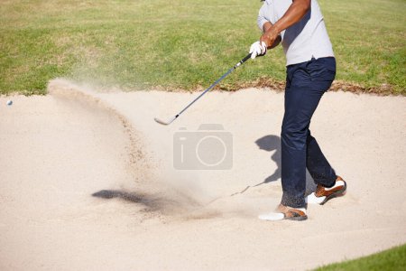 Photo for Man, golfer and swing on golf course in sand pit for par, stroke or strike on grass field in nature. Closeup of male person or sport player hitting ball out of dirt for point or tough outdoor shot. - Royalty Free Image