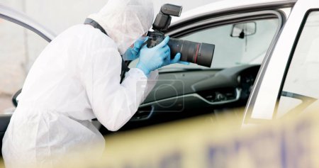 Car, crime scene and forensic photographer with pictures for evidence in court, working and investigation. Adult, person and employee for police department, professional and protection suit for DNA.