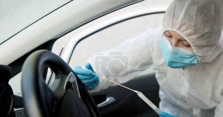 Photo for Science, csi and swab for dna evidence in crime scene car for investigation of accident and burglary with hazmat..Forensic, research analysis and person with sample collection for medical observation. - Royalty Free Image