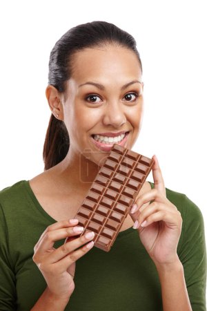 Photo for Woman, portrait and chocolate in isolated, white background and smile in studio. Female person, happy and sweets in backdrop with candy, dessert and food for diet, snack and cocoa for nutrition. - Royalty Free Image