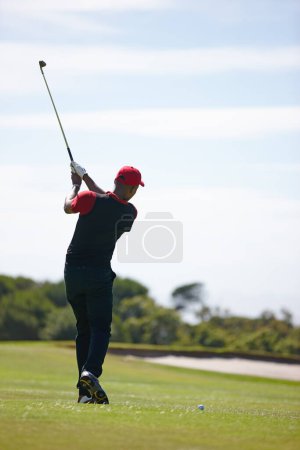 Photo for Man, back and swing with golf course for stroke, point or strike on grass field in nature. Rear view of male person, golfer or sports player missing ball for game or outdoor match on mockup space. - Royalty Free Image