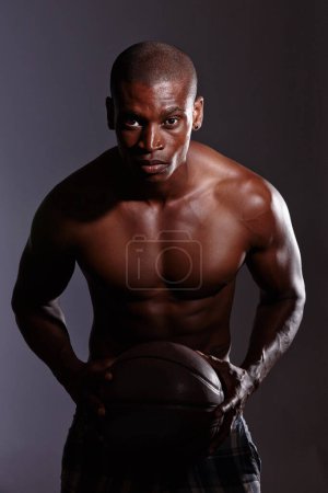 Blackman, studio and dark background or basketball or shirtless at night, sports or fitness or athlete. Sportsman, healthy and muscular with confidence for game or exercise, focus and strength.