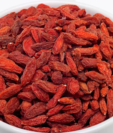 Photo for Dried, goji berries and bowl in studio for nutrition, natural, organic and antioxidant as snack for full body. Fresh, fruit and red seeds produce vitamin c, fibre and nutrients for weight loss. - Royalty Free Image
