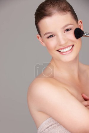 Photo for Woman, smile and portrait with makeup brush for spa skincare and dermatology for aesthetic cosmetic beauty in studio. Young person or model and happy with clean face for hygiene, fresh and pamper. - Royalty Free Image