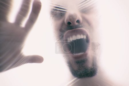 Man, plastic and bag with suffocating, gasping and struggle for breath in white background. Male person, expression and choking in crisis for awareness, help and anxiety in mental health or wellness.