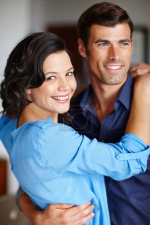 Photo for Couple, together and happy hug in portrait for love, romance and memories. Man, woman and intimate embrace for relationship smiling for passion, connection or bonding affectionate and caring. - Royalty Free Image