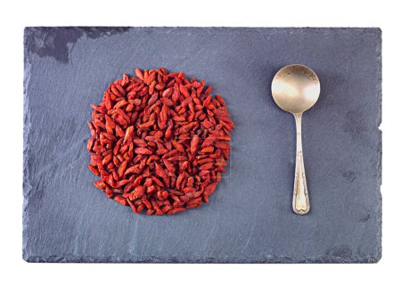 Photo for Pile, healthy and goji berries with spoon in studio for nutrition, organic and antioxidant as snack for health. Vegan, fruit and seeds produce vitamin c for wellness on isolated white background. - Royalty Free Image
