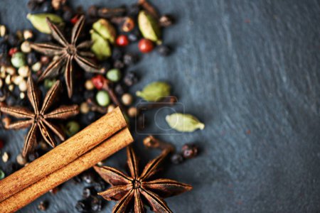 Photo for Whole spices, ingredients and cooking for food with mockup, fragrance and flavor with culinary space. Stick cinnamon, star anise and peppercorn with cardamom mix for catering, seasoning and aroma. - Royalty Free Image