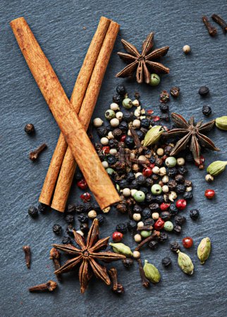 Photo for Whole spices, collection of ingredients and cooking for food, fragrance and flavor with culinary background. Stick cinnamon, star anise and cardamom with peppercorns for catering, seasoning and aroma. - Royalty Free Image