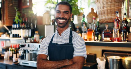 Photo for Welcome, coffee shop and confident portrait of man at bar with smile, waiter or manager at restaurant startup. Bistro, service barman and happy small business owner at cafe counter with arms crossed - Royalty Free Image