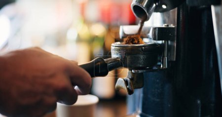 Photo for Cafe, coffee grinder and hands pouring espresso with barista, small business and hospitality. Cappuccino, ground beans and service, person in bistro or restaurant with hot drink, latte or fresh brew - Royalty Free Image