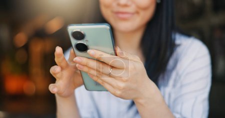 Photo for Hands, woman and phone for texting, closeup or happy for funny video, meme or comic web blog. Girl, Japanese person and smartphone for typing, scroll or click for reading notification on social media. - Royalty Free Image
