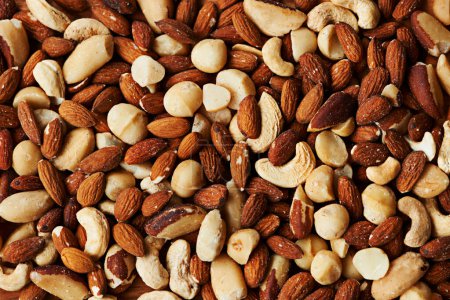 Photo for Nuts, mix and organic snack for health, selection and variety of options for fat and minerals. Closeup, nutrition and textures of vitamins or antioxidants, wellness and cashew or almonds for energy. - Royalty Free Image