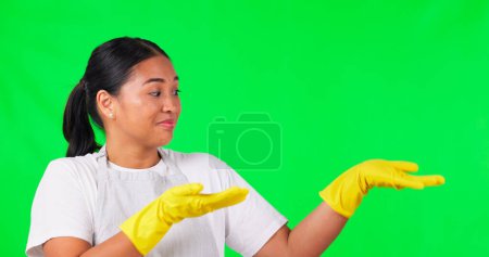 Photo for Cleaning, presentation and pointing with woman on green screen for idea, choice and decision. Advertising, hygiene and show with portrait of person on studio background for offer, opinion and mockup. - Royalty Free Image