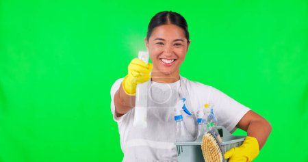 Photo for Woman, cleaner and spray for hygiene, green screen and household maintenance with cleaning product choice. Detergent bottle, service and chemical, female person and mockup space on studio background. - Royalty Free Image